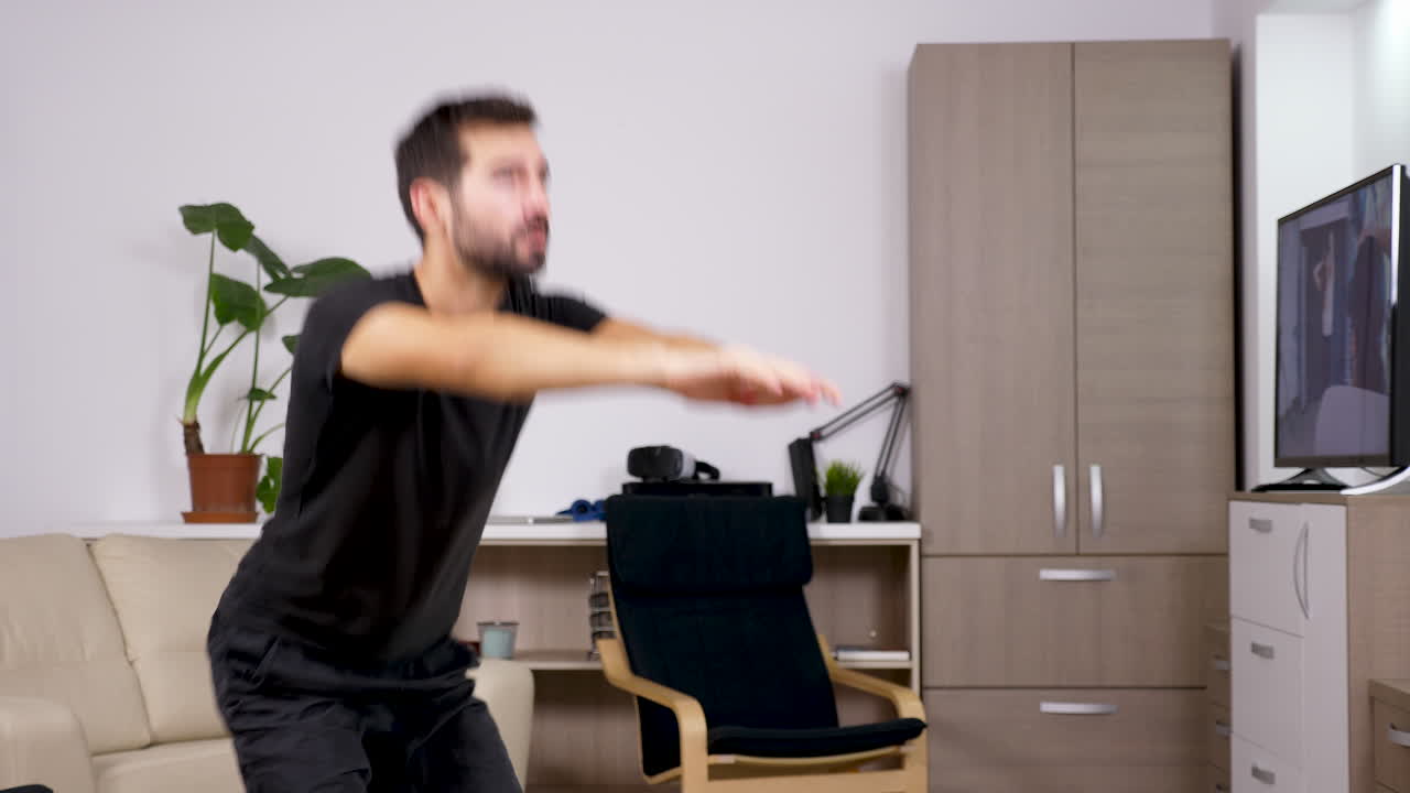 Man doing squats in living room