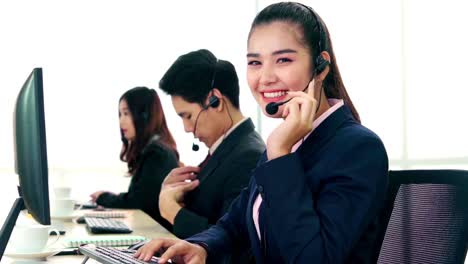 Business-people-wearing-headset-working-in-office