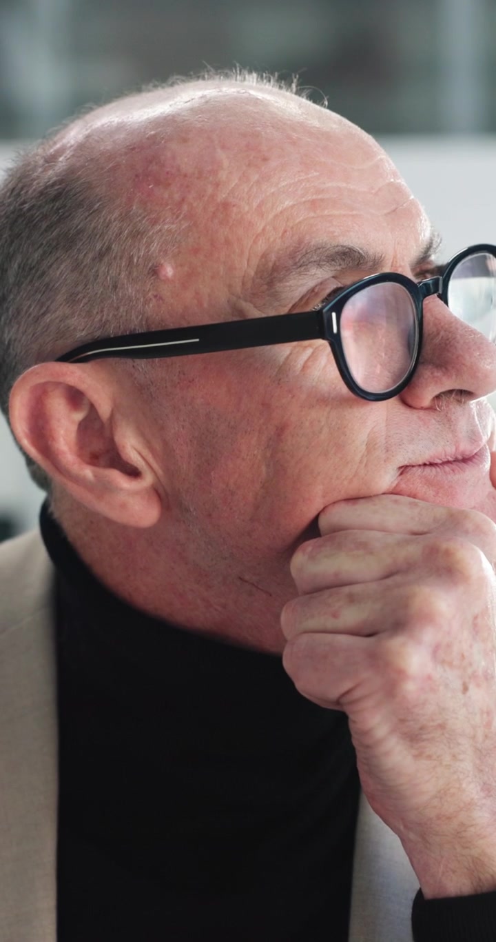Thoughtful Mature Man Wearing Glasses Looking Away