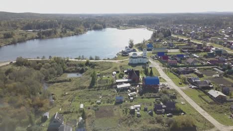 aerial view of a russian village by a lake