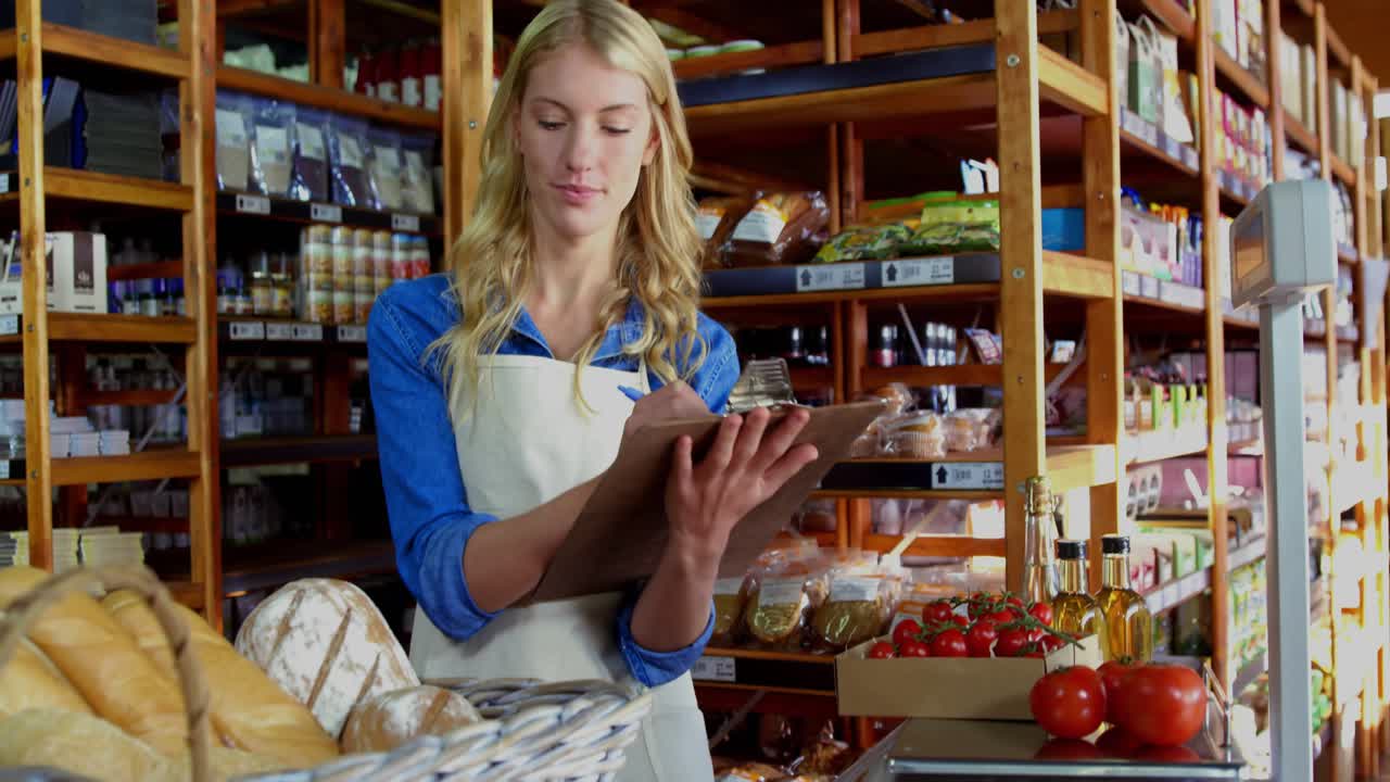 Grocery clerk writing stock notes, causing world map overlay moving across shelves showing origins