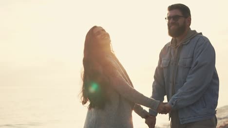 couple enjoying sunset on the beach