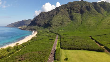 cars driving on farrington highway along the waianae coast of oahu, aerial