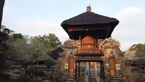 Entrance-to-a-Balinese-Temple-Pavilion-Bali-Hinduism-in-Ubud,-Nyuh-Kuning-Golden-Ornaments-and-Garden