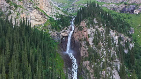 descending aerial shot barskoon waterfall in fairy tale canyon in kyrgyzstan