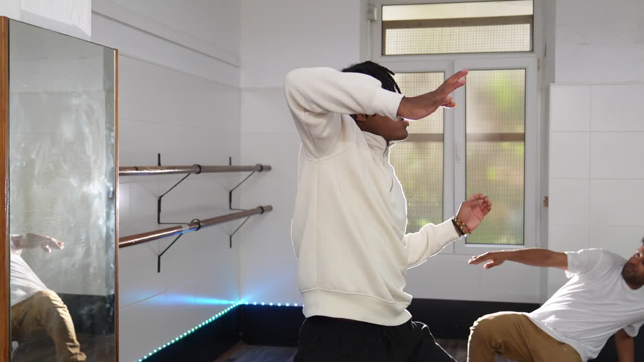 Two men dancing in a dance studio