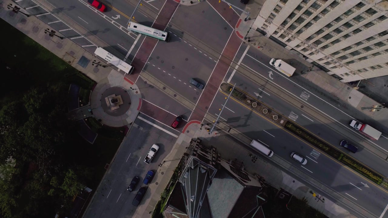 Aerial Time Lapse of City Intersection with Moving Traffic and Church