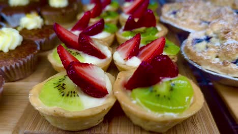 close-up of kiwi and strawberry tarts and patisserie - french