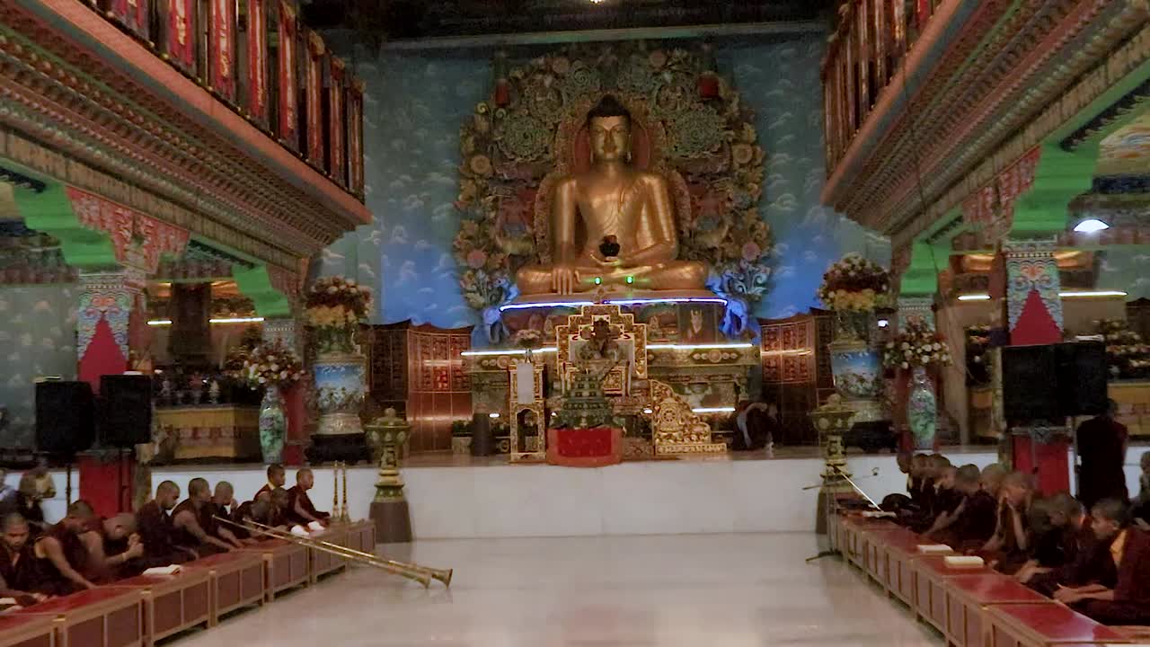 huge golden buddha statue at buddhist monastery from flat angle video taken at tergar monastery bodh gaya bihar india on Feb 11 2020.