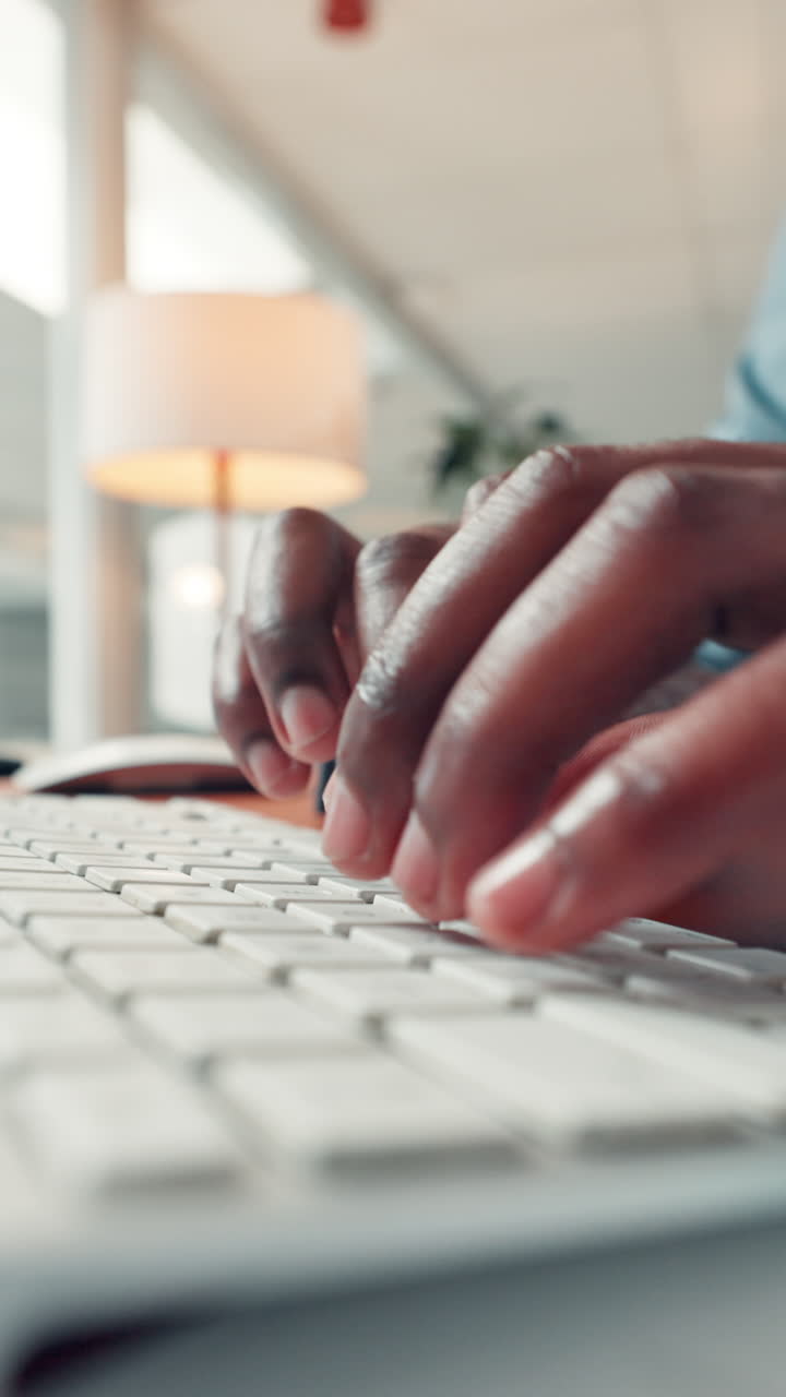 Close Up of Hands Typing on a White Computer Keyboard
