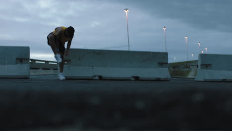 dancing man young break dancer performing modern hip hop dance moves practicing urban freestyle choreography in cloudy urban city