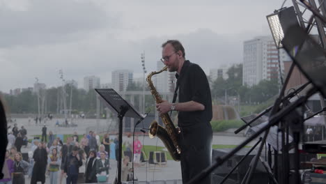 saxophonist performing outdoor concert