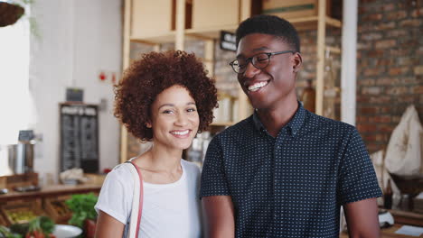 Portrait-Of-Couple-Shopping-In-Sustainable-Plastic-Free-Grocery-Store