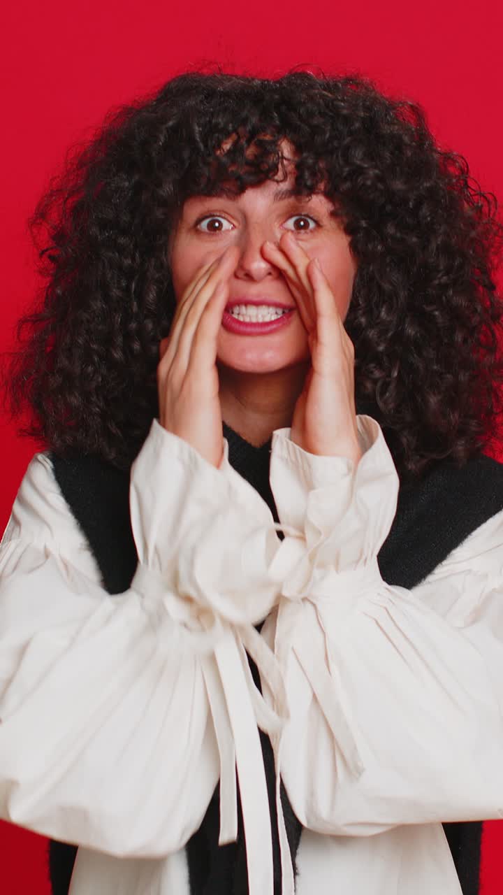 Young woman whisper news rumors holding hands near mouth share gossip quiet keep my secrets