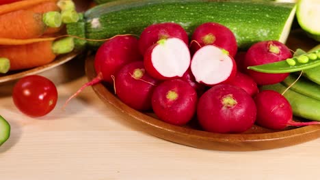 assorted vegetables displayed on a wooden surface