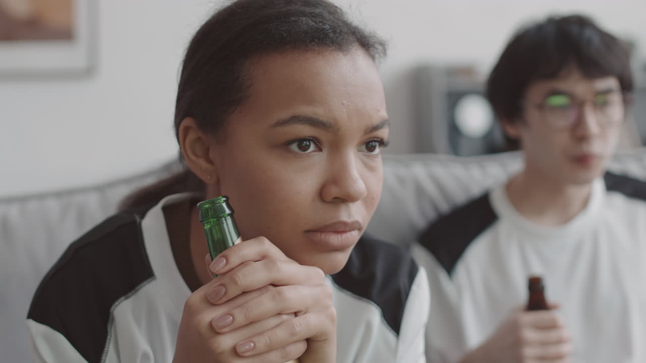 Concerned Mixed-Race Woman Watching TV