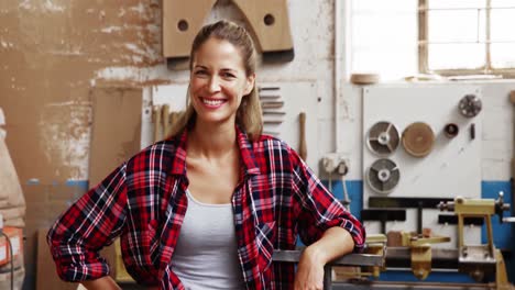 portrait of attractive carpenter smiling for camera