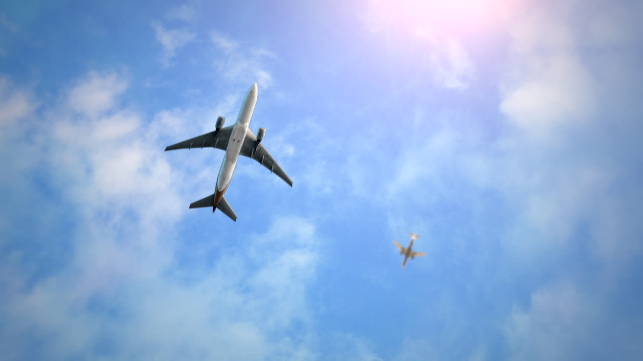 Flying airplanes in blue sky with clouds