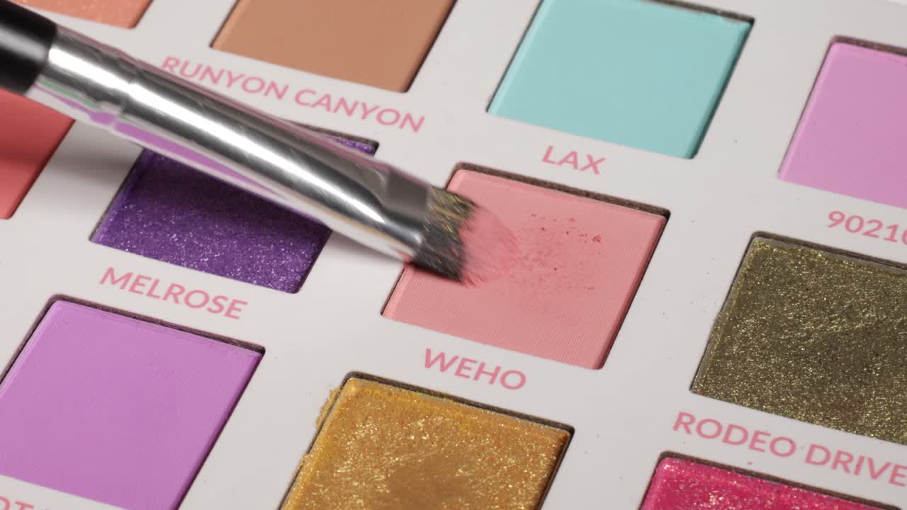 Shot of brush using eyeshadow from palette (weho).