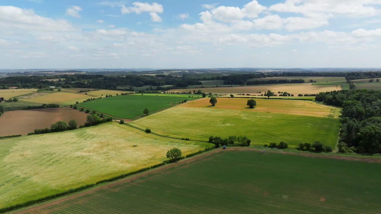 Rural Scene Of Agricultural Fields In The Cotswolds, United Kingdom. Aerial Drone Shot