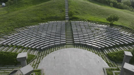 Aerial-shot-of-Didgori-Valley-memorial-monuments,-amphitheatre-and-landscape