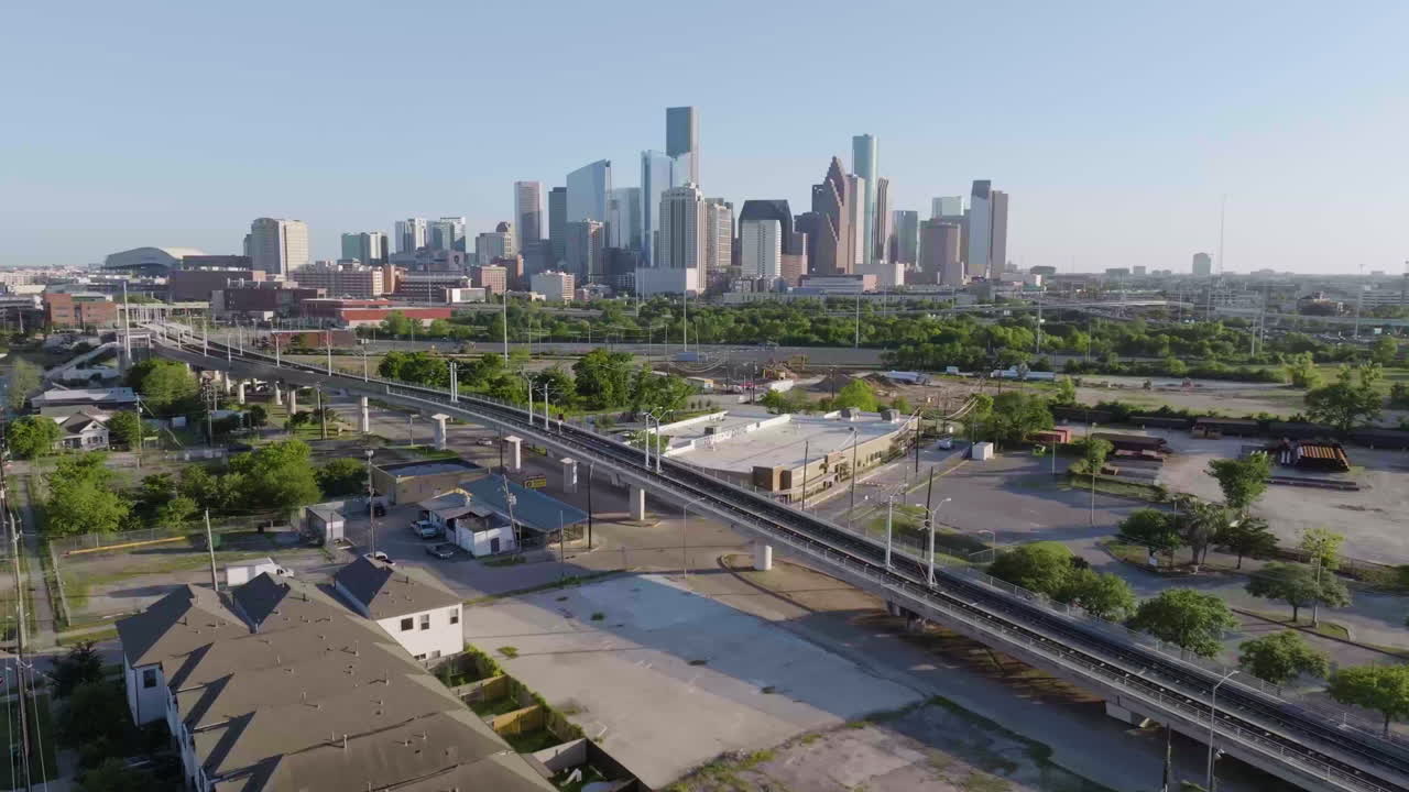 Aerial view of the metrorail and the downtown skyline, golden hour in Houston
