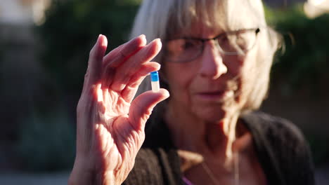 An-old-woman-with-a-disease-finding-hope-in-a-newly-discovered-prescription-drug-pill-to-cure-her-illness