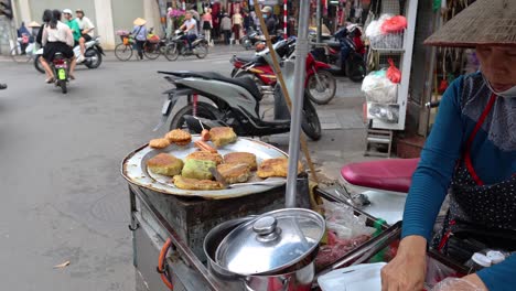 vendor prepares food amidst busy street traffic