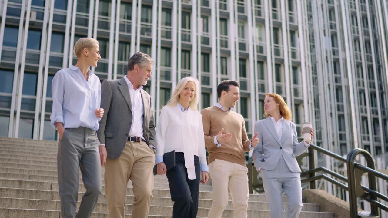Business people walking down the stairs