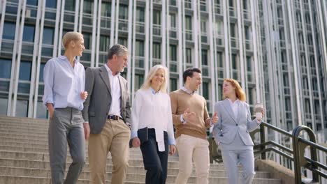 business people walking down the stairs