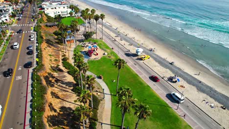oceanside beach and park with palm trees