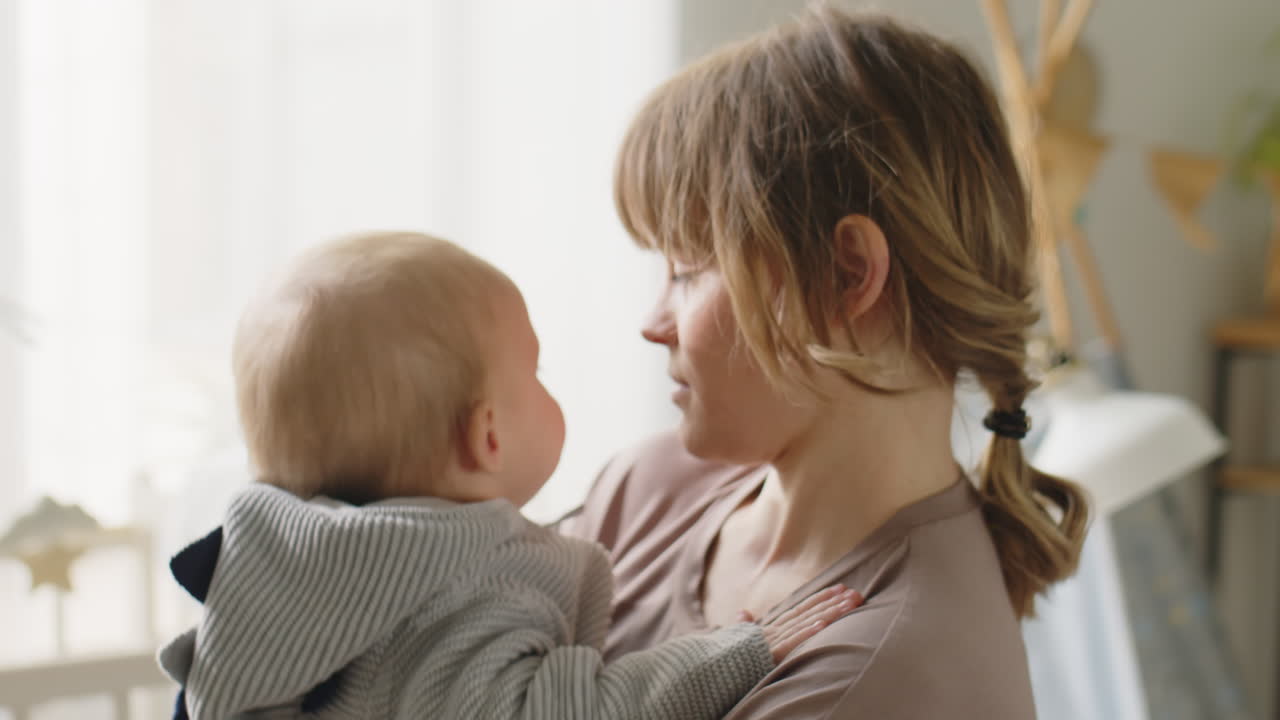 Loving Mother Rocking Baby