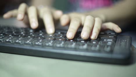 woman typing on keyboard office