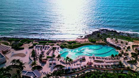 TRS-Yucatan-Resort-in-Tulum-Mexico-sliding-left-drone-shot-of-the-infinity-pool-and-facing-the-Caribbean-Sea