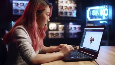 a young woman engaged in digital art creation, skillfully manipulating 3d models and coding on her laptop in a modern, creative studio environment