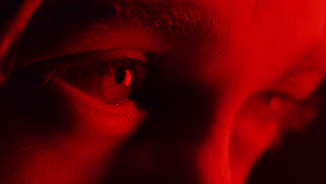 close-up-macro-eyes-opening-looking-at--intense-red-light