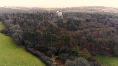 aerial view of an observatory in a forest