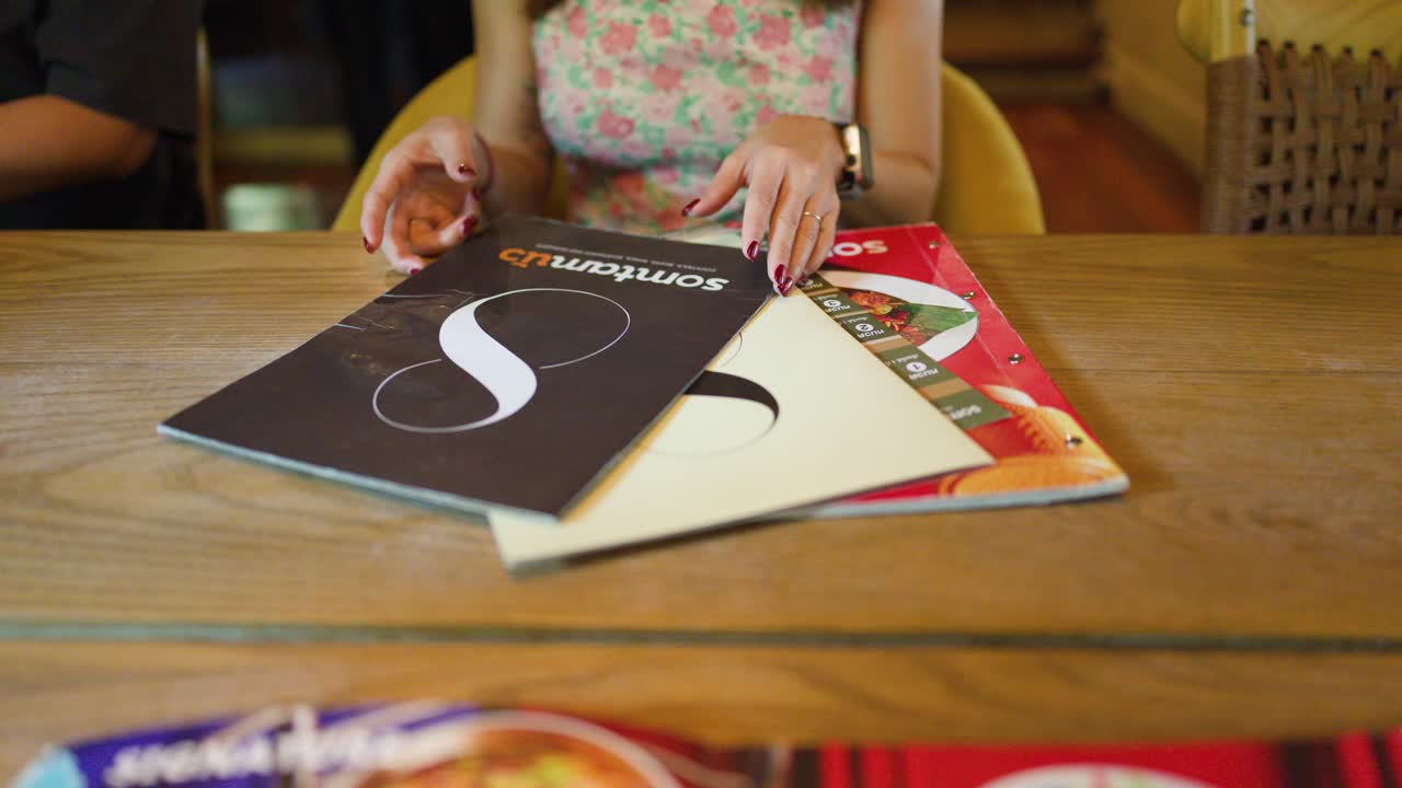 Woman reading a menu in a restaurant