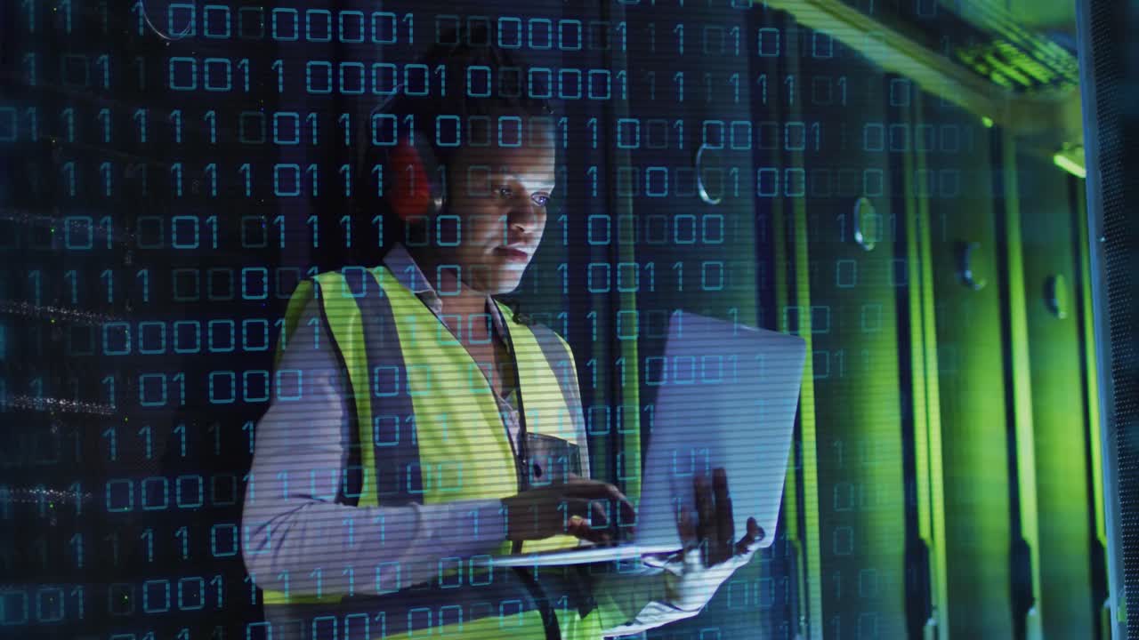 Animation of binary coding over african american male it engineer and computer servers