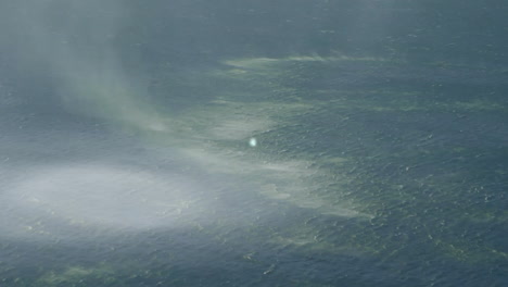 animation of icons connected with lines over aerial view of ocean