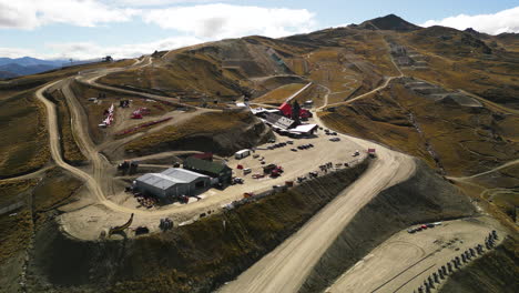 Snowless-Cardrona-alpine-resort-during-autumn,-aerial-drone-view