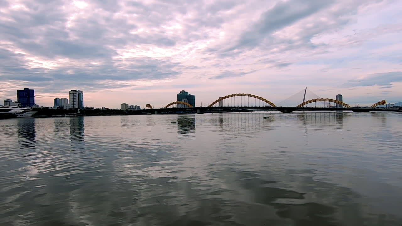 Standing and looking at the bridge in Da Nang (Vietnam).
