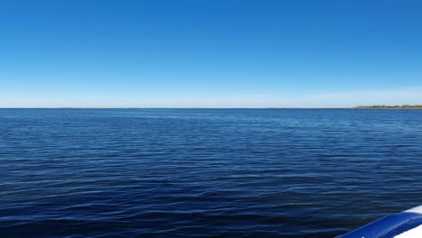 riding a boat at the coast of the baltic sea in sunny weather