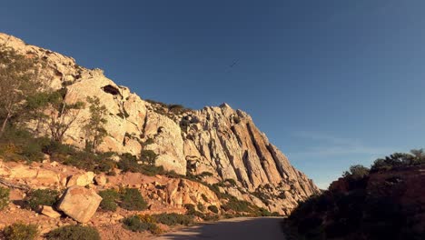 Exploring-the-Mediterranean-terrain-bathed-in-sunlight-and-dry-climate,-seizing-a-moment-along-the-Spanish-coast