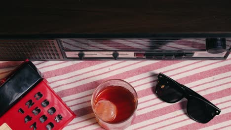 vintage retro setup with drink and sunglasses