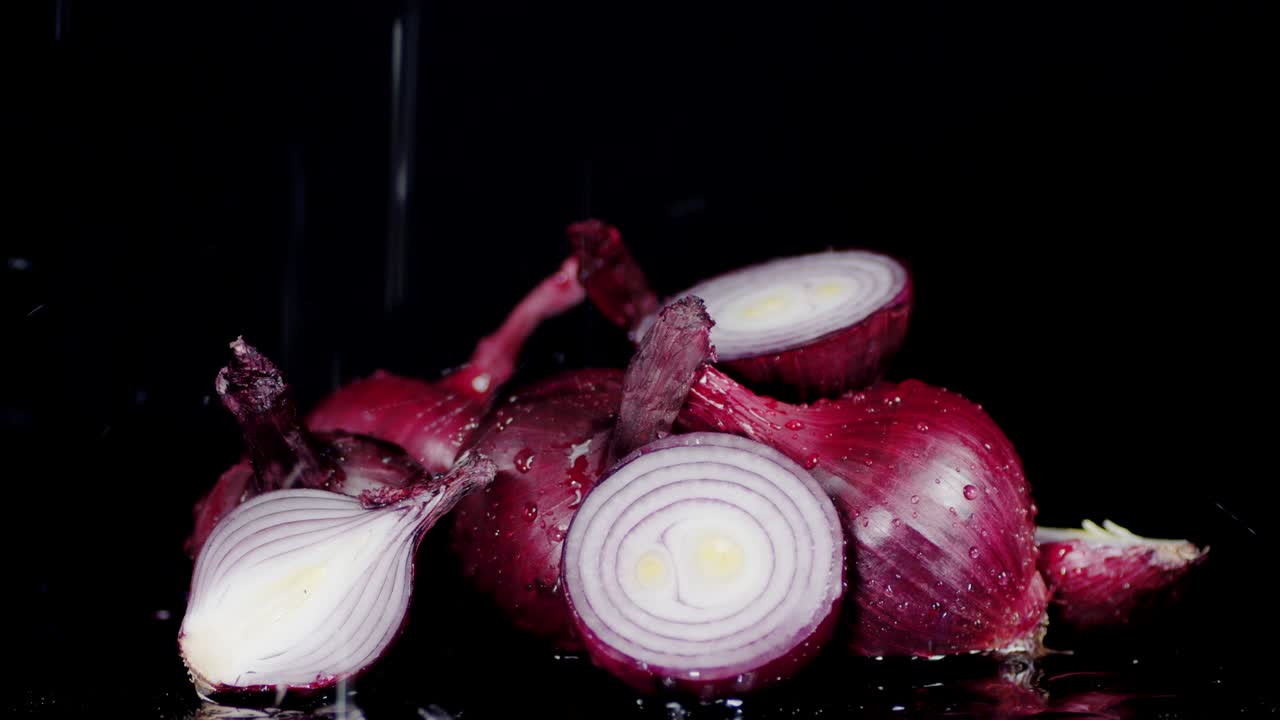 Drops of water falling on fresh onion.