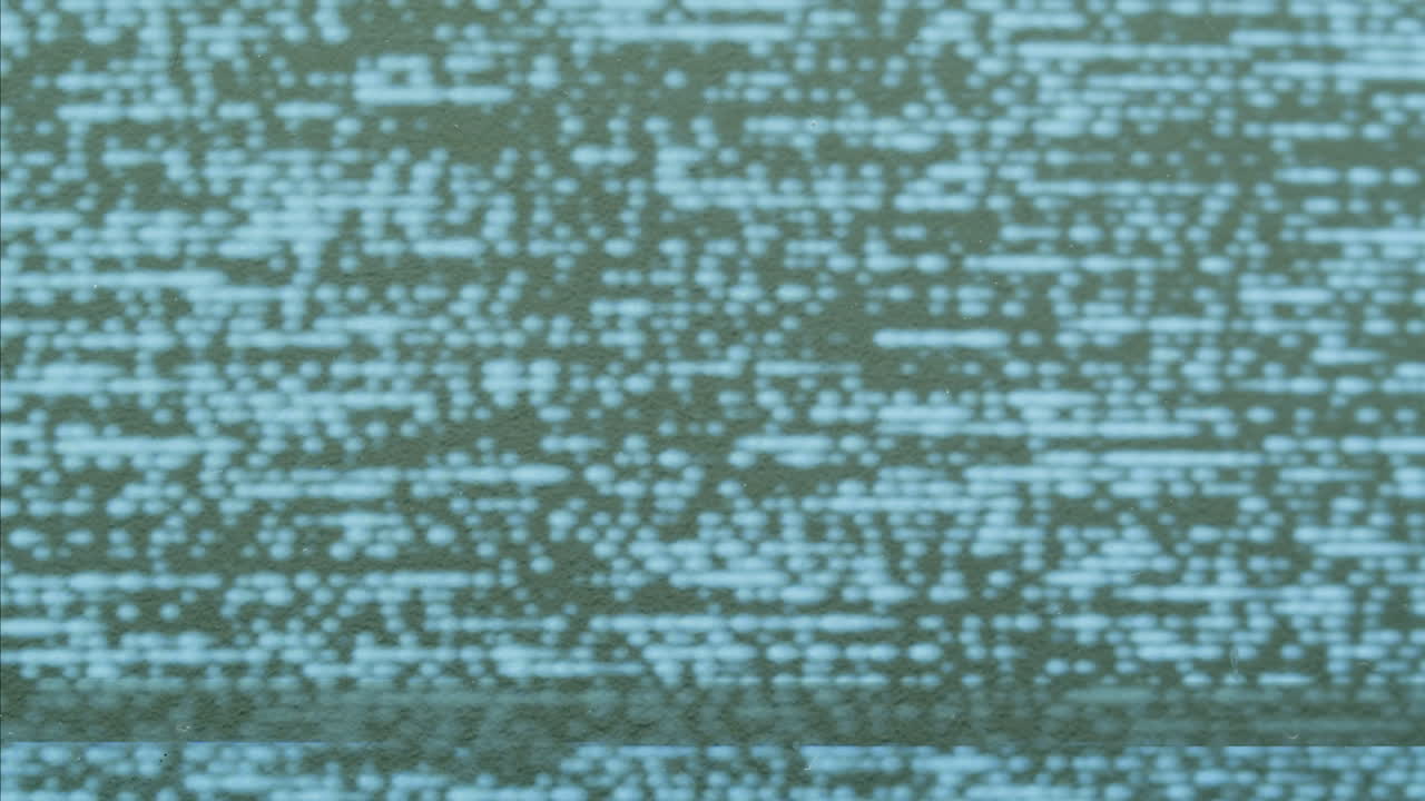 A retro TV displaying static noise, creating a nostalgic vintage atmosphere with blue and green hues.