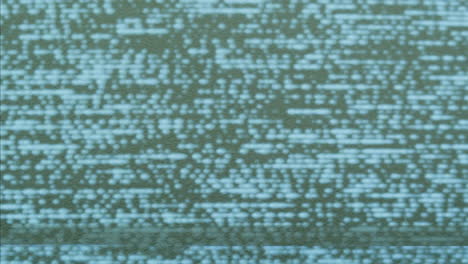 a retro tv displaying static noise, creating a nostalgic vintage atmosphere with blue and green hues.
