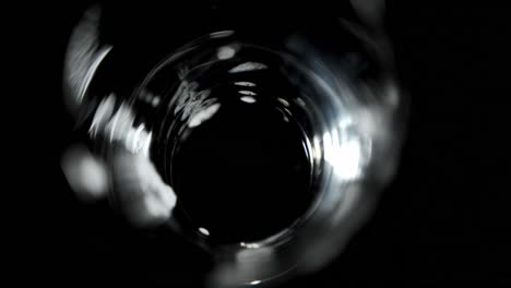 beer poured in glass against black background 4k