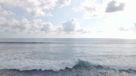 Aerial-View-of-waves-crashing-on-a-sunny-day-Dominical-Beach,-Costa-Rica,-Tracking-Shot